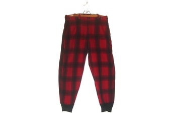 May include: Red and black plaid pants with a black waistband and cuffs.