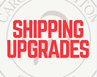 May include: A circular logo with the words "Carolina Cotton Company" in a light gray font. The words "Shipping Upgrades" are in a bold, red font, centered within the logo.