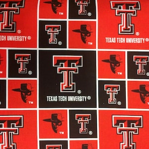 May include: Fabric with a repeating pattern of the Texas Tech University logo, a stylized "T" in red and black, and the masked Raider Red mascot. The words "TEXAS TECH UNIVERSITY" are also visible. The design is on a red and black background.