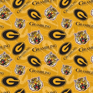 May include: A yellow and black pattern featuring the Grambling State University logo, a tiger head, and the letter "G" in a circle. The background is a yellow color with a distressed texture.