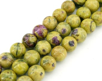 May include: A strand of round, green and purple gemstone beads. The beads have a mottled, speckled appearance.