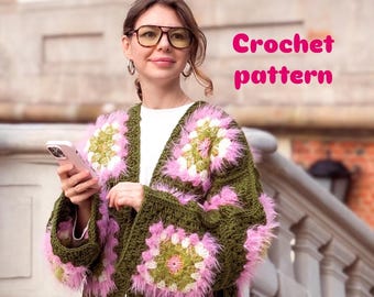 May include: A green crochet cardigan with pink and white floral patterns and fluffy trim. The words "Crochet pattern" are in pink text on the image. The cardigan is open-fronted and has long sleeves.