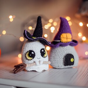May include: Two crocheted Halloween decorations, a ghost wearing a witch's hat and a witch's house with a door and a window.