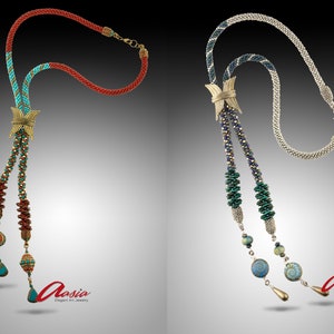 May include: Two beaded necklaces with decorative pendants. The necklace on the left has red, turquoise, and gold beads. The necklace on the right has silver, blue, and green beads.