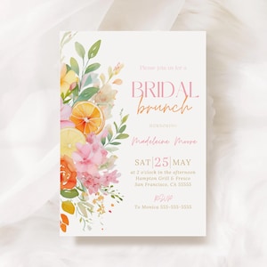 May include: A bridal brunch invitation with floral watercolor illustrations. The invitation features the text "BRIDAL brunch" in pink and orange, along with event details. The design includes orange and lemon slices, pink flowers, and green leaves.