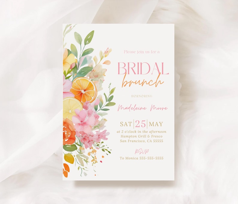 May include: A bridal brunch invitation with floral watercolor illustrations. The invitation features the text "BRIDAL brunch" in pink and orange, along with event details. The design includes orange and lemon slices, pink flowers, and green leaves.