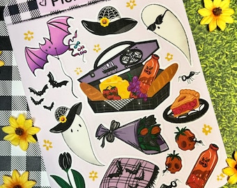 May include: A set of 12 Halloween-themed stickers featuring a picnic basket, a ghost, a bat, a pie, a bouquet of flowers, a blanket, and other spooky details. The stickers are printed on white paper with a pink background and the text "Picnic Date" at the top.