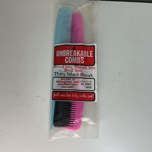 May include: A package containing four unbreakable combs in blue, pink, and black. The combs are labeled "Unbreakable Combs" with text that reads "Bend 'em, Twist 'em, Boil 'em, They Won't Break." The package also states "You'll never have to buy another comb!"