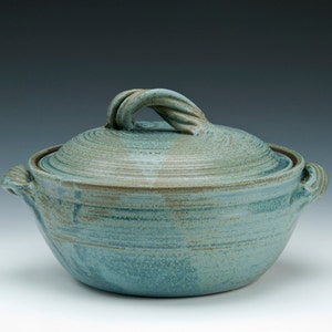 Lidded Pottery Casserole Dish with twisted strap handle