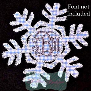 May include: A snowflake-shaped applique with a blue and white gingham pattern. The snowflake has a white lace trim and a monogram in the center. The text "Font not Included" is in the upper right corner.