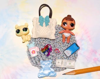 Mini baby doll and accessories