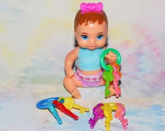 ONE mini key ring toy with 3 keys. Personalize your colors.