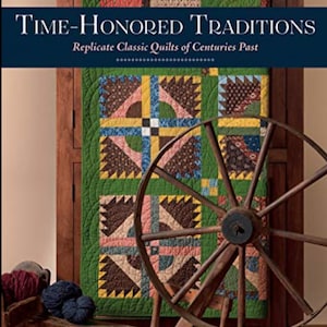 May include: A book titled "Time-Honored Traditions: Replicate Classic Quilts of Centuries Past" by Annette Plog. The cover features a quilt with a green background and a spinning wheel.