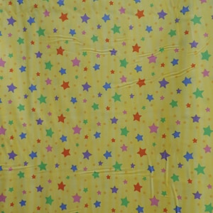 Stars, stars, and more stars on a yellow background.