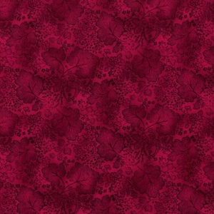 A Jinny Beyer leaf pattern in magenta color.