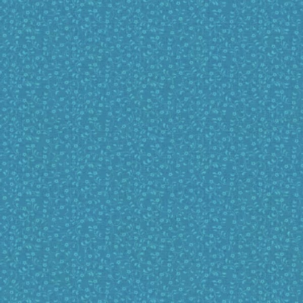 Turquoise colored fabric with tiny floral design from Riley Blake Designs.