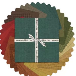 May include: A collection of fabric squares in various shades of green, brown, and red, arranged in a circular pattern. The central stack is wrapped with a white ribbon printed with "MAYWOOD STUDIO". The fabrics have a textured appearance.