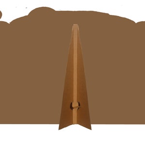 May include: Brown cardboard cutout of a train with a stand for displaying it. The stand is made of brown cardboard and has a fold-over design.