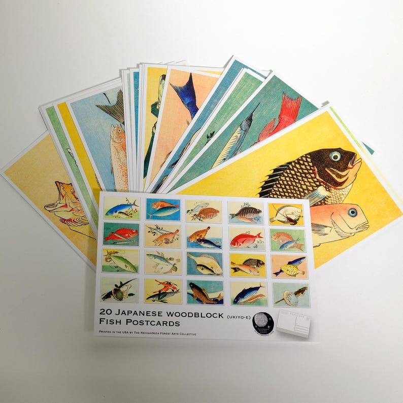 May include: A set of 20 Japanese woodblock fish postcards. The postcards feature colorful illustrations of various fish species. The text on the front of the postcards reads "20 Japanese Woodblock (Ukiyo-e) Fish Postcards".