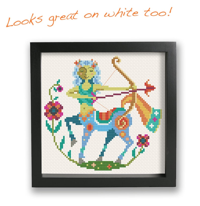 May include: A colorful cross-stitch pattern of a Sagittarius zodiac sign. The Sagittarius is depicted as a centaur with a bow and arrow, surrounded by flowers. The design is framed in a black frame.