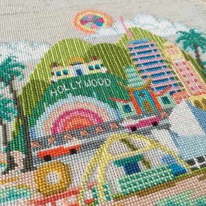 A cross stitch embroidery pattern of Los Angeles featuring famous landmarks and monuments.