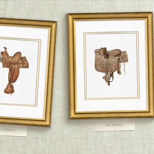 May include: Two framed illustrations of saddles, one labeled "California" and the other "Oklahoma".