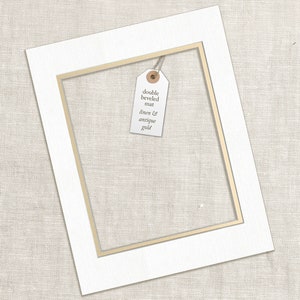 a couple of framed pictures hanging on a wall