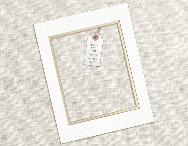 a couple of framed pictures hanging on a wall