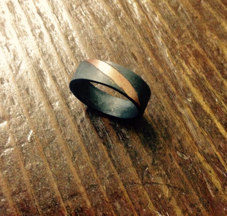Wedding band in oxidized sterling silver with a rose gold stripe