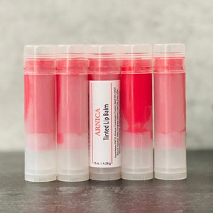 Bulk Red Tinted Arnica Lip Balm Sticks Sheer Strawberry Wholesale Lip Butter w/ Private Label Unlabeled Post Lip Filler Moisturizer image 1