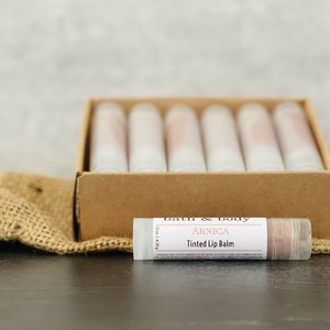 12 Arnica Lip Balm Sticks Clear or Tinted Chapsticks Unlabeled Private Label Med Spa Branded Gifts Pink Brown Red Aesthetics BrownTint ArnicaBalm