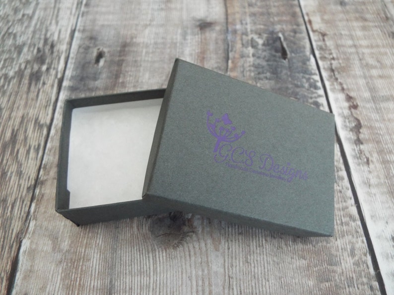 Custom hand stamped silver stacking ring with symbol or initial. Sterling silver personalised ring with charm