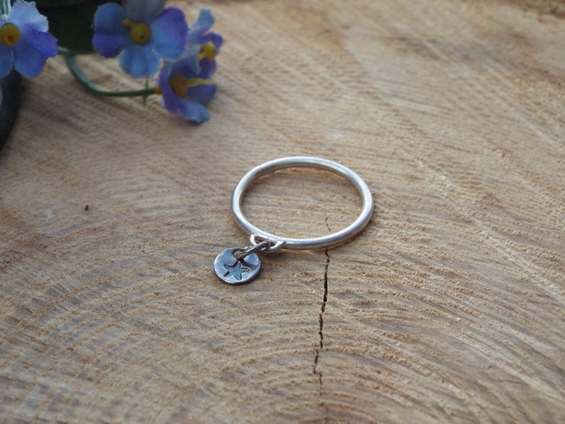 Custom hand stamped silver stacking ring with symbol or initial. Sterling silver personalised ring with charm