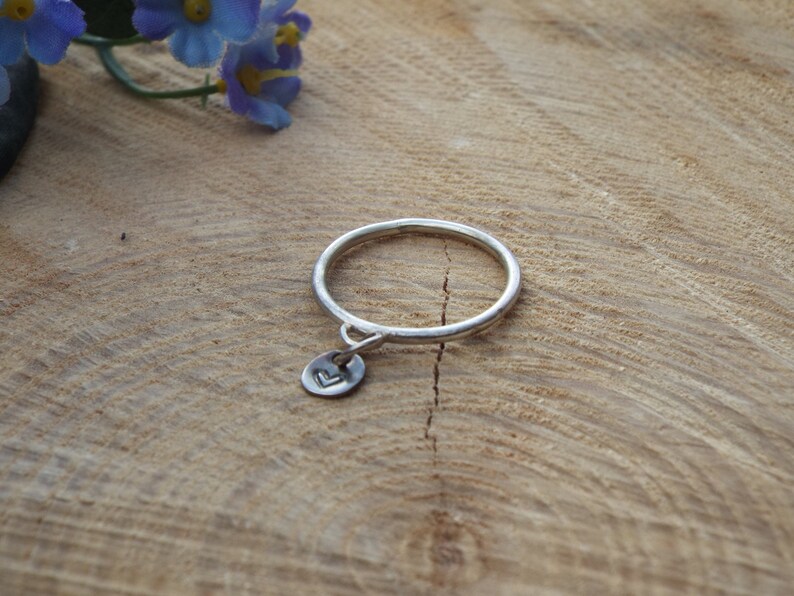 Custom hand stamped silver stacking ring with symbol or initial. Sterling silver personalised ring with charm