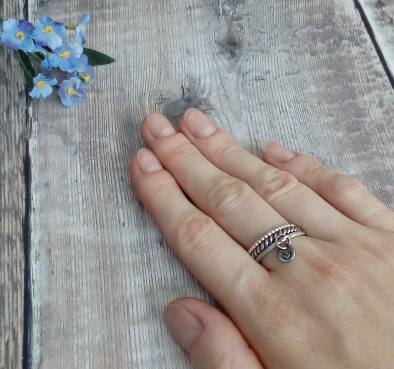 Custom hand stamped silver stacking ring with symbol or initial. Sterling silver personalised ring with charm