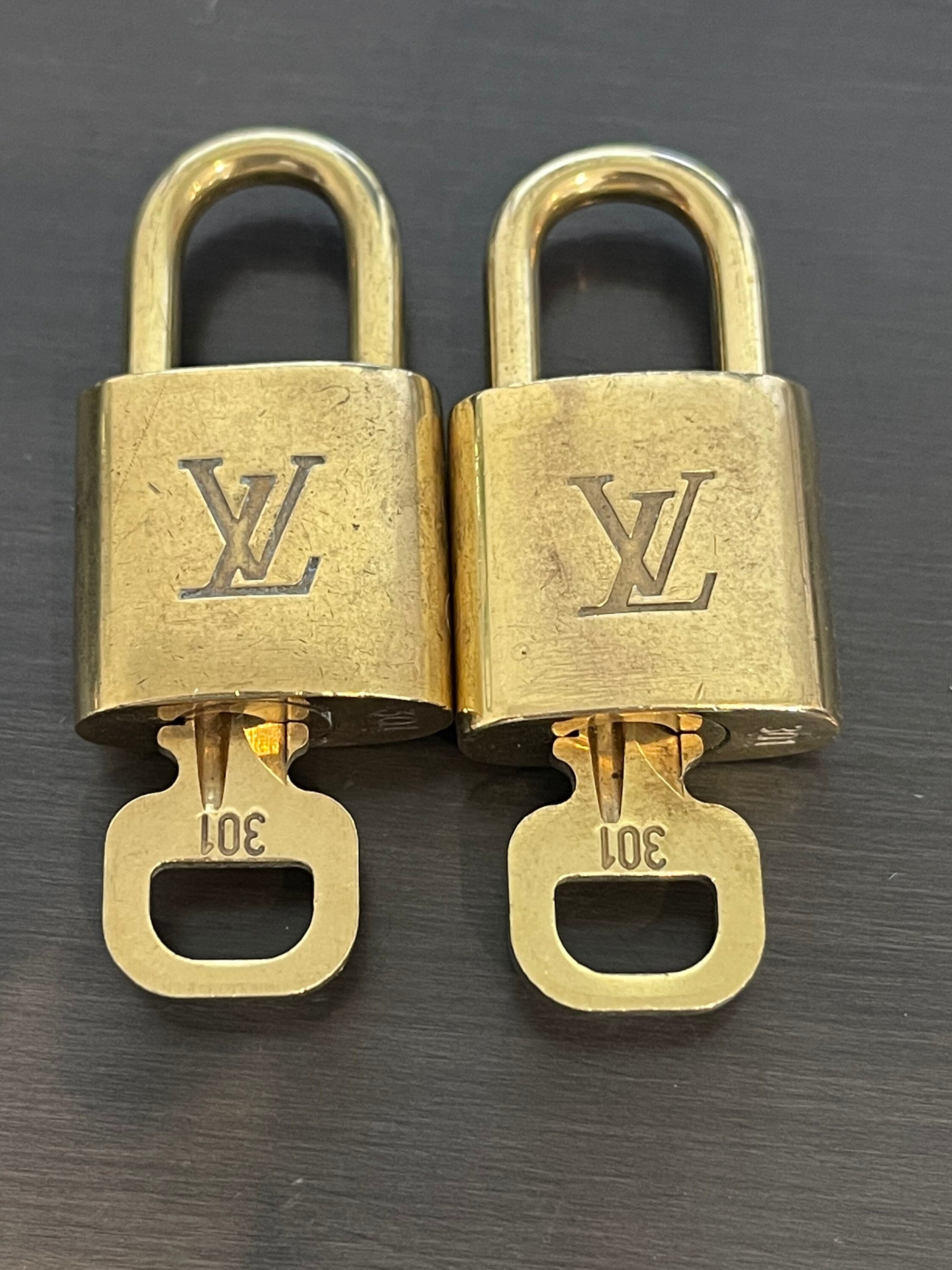 Louis Vuitton lock with key No. 301 - I Love Handbags