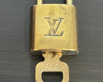 Lot - A Louis Vuitton Padlock w/ 2 Keys
