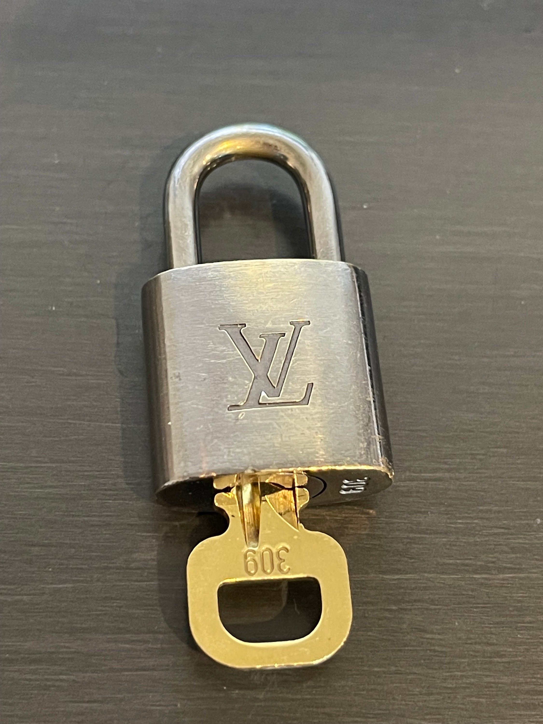 silver louis vuitton lock