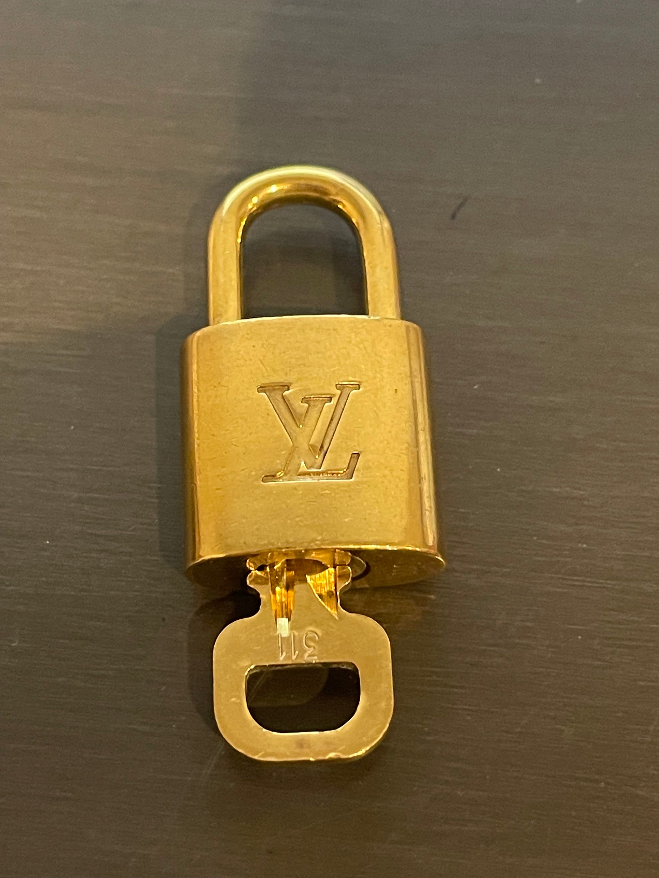 Repurposed vintage brass Louis Vuitton padlock 311 with layered style  necklace chains