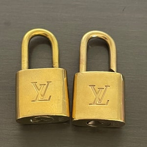 louis vuitton bag with lock and key