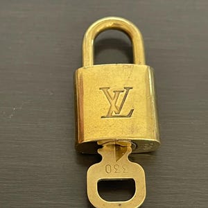 Cadeado especial Louis Vuitton Pinkerly e uma chave #330, latão
