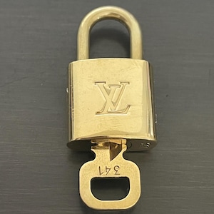 Cadeado especial Louis Vuitton Pinkerly e uma chave nº 341, latão