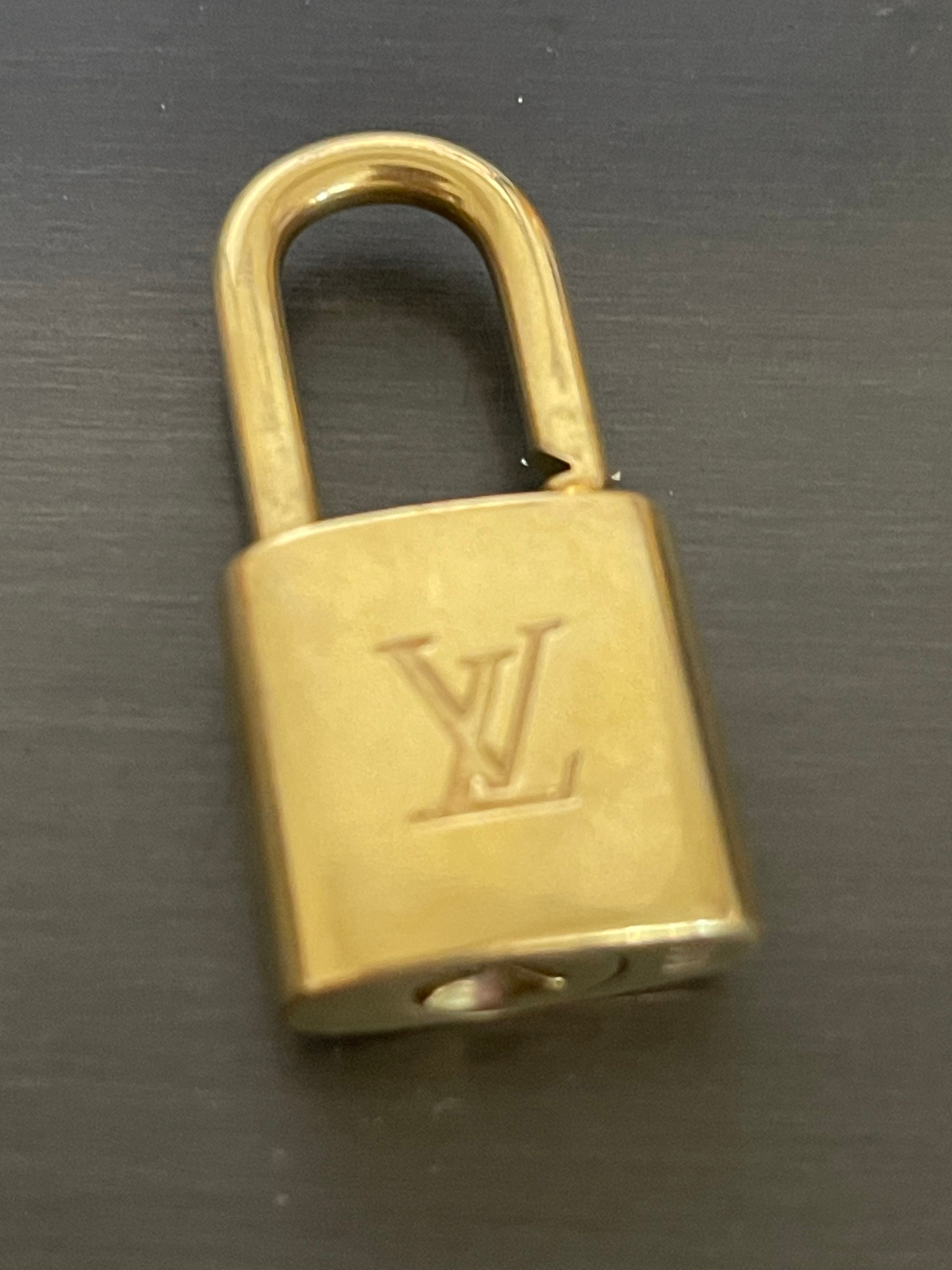 Sold at Auction: Louis Vuitton, LOUIS VUITTON PadLock Lock Key Brass Gold  Authentic Number Random Bag Accessory