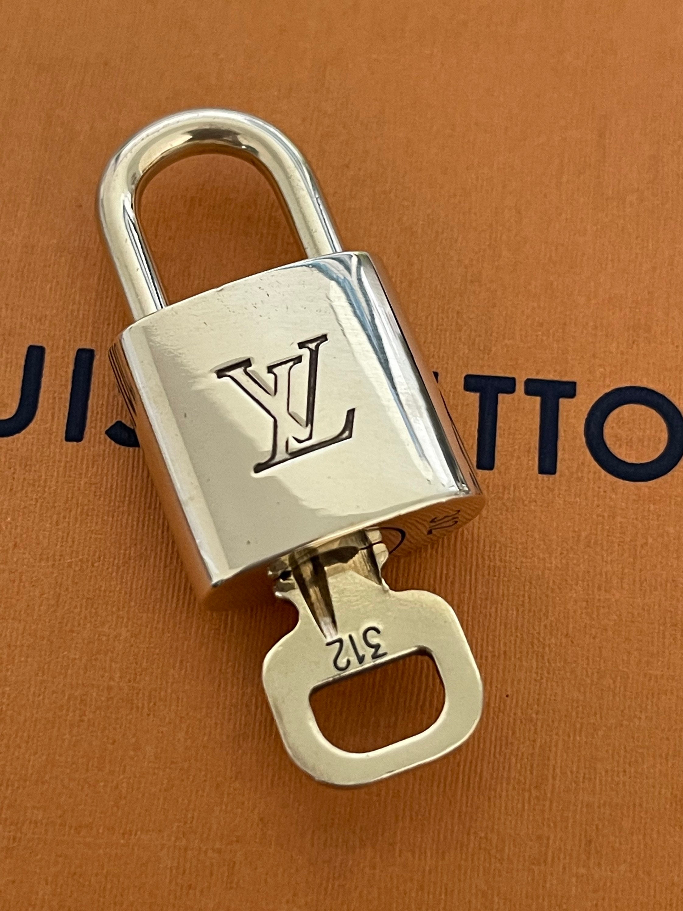 Louis Vuitton lock with key No. 301 - I Love Handbags