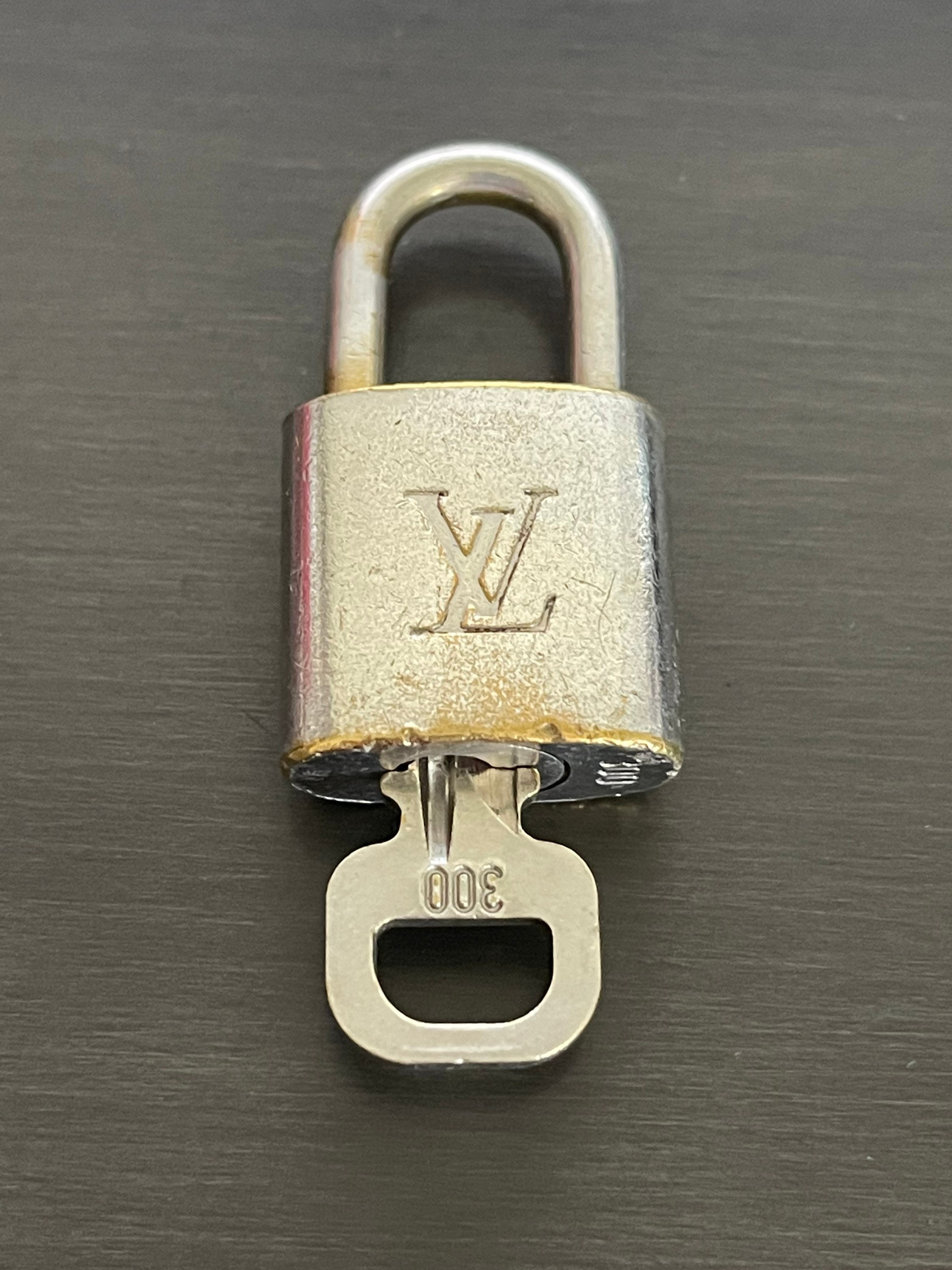 Louis Vuitton padlock and one key 300 bag charm lock silver Etsy