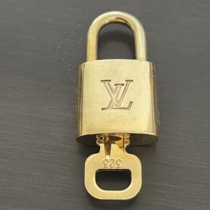 Cadeado especial Louis Vuitton Pinkerly e uma chave #323, latão