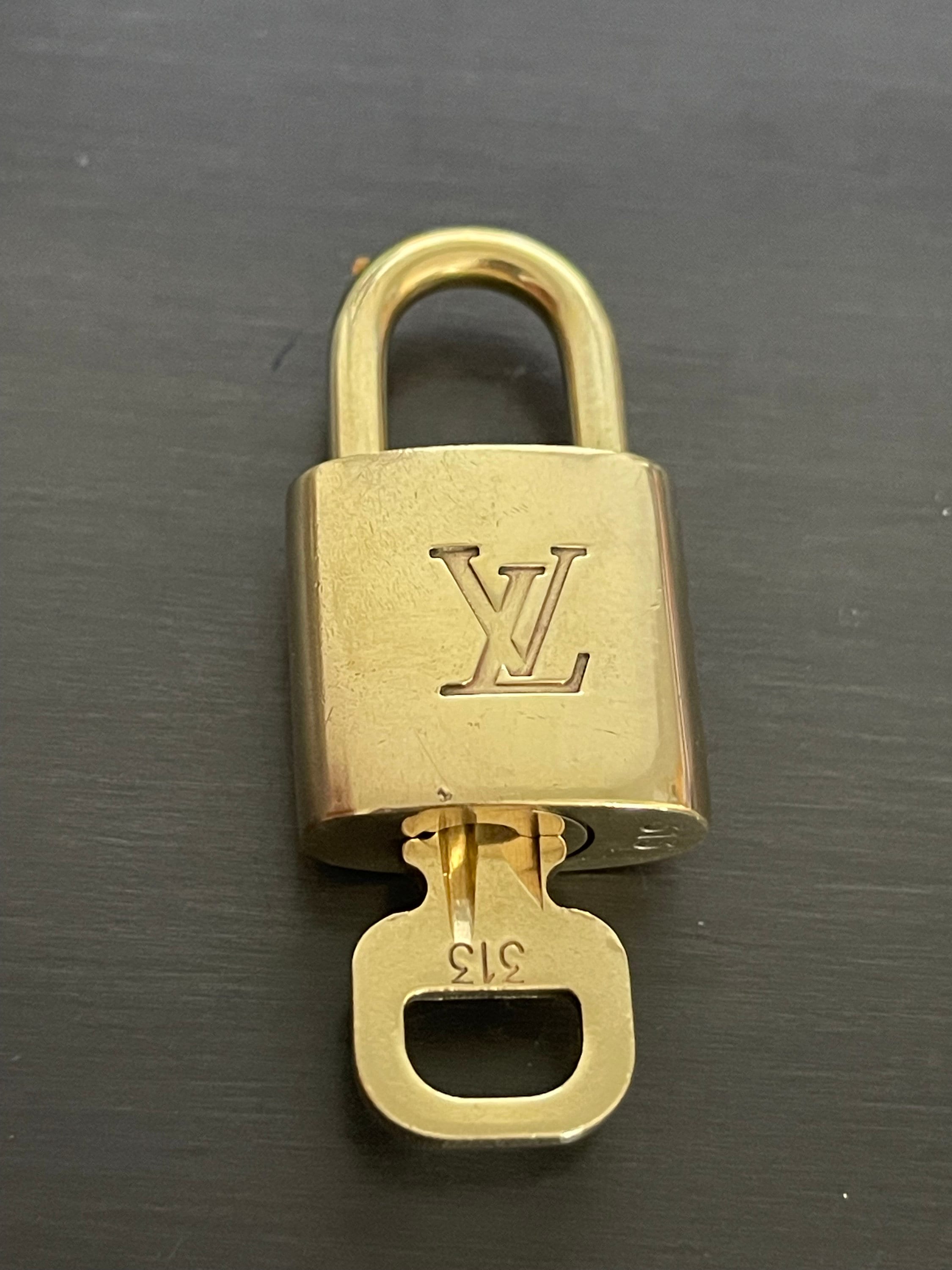 Louis Vuitton Lock & Key 332  Luxury brand names, Louis vuitton, Vuitton