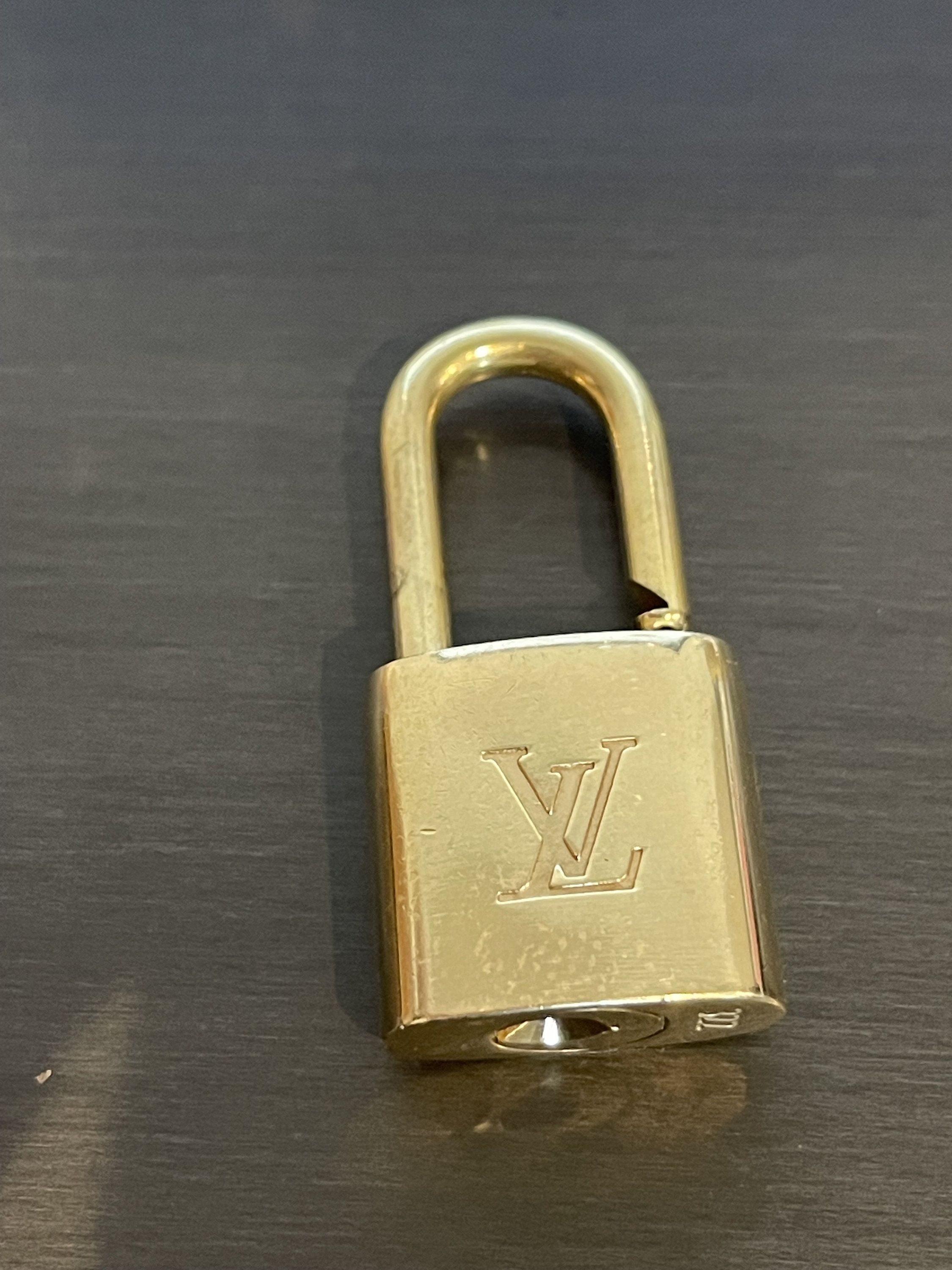 Louis Vuitton Clear Resin & Gold Metal LV Prism Bag Charm, myGemma