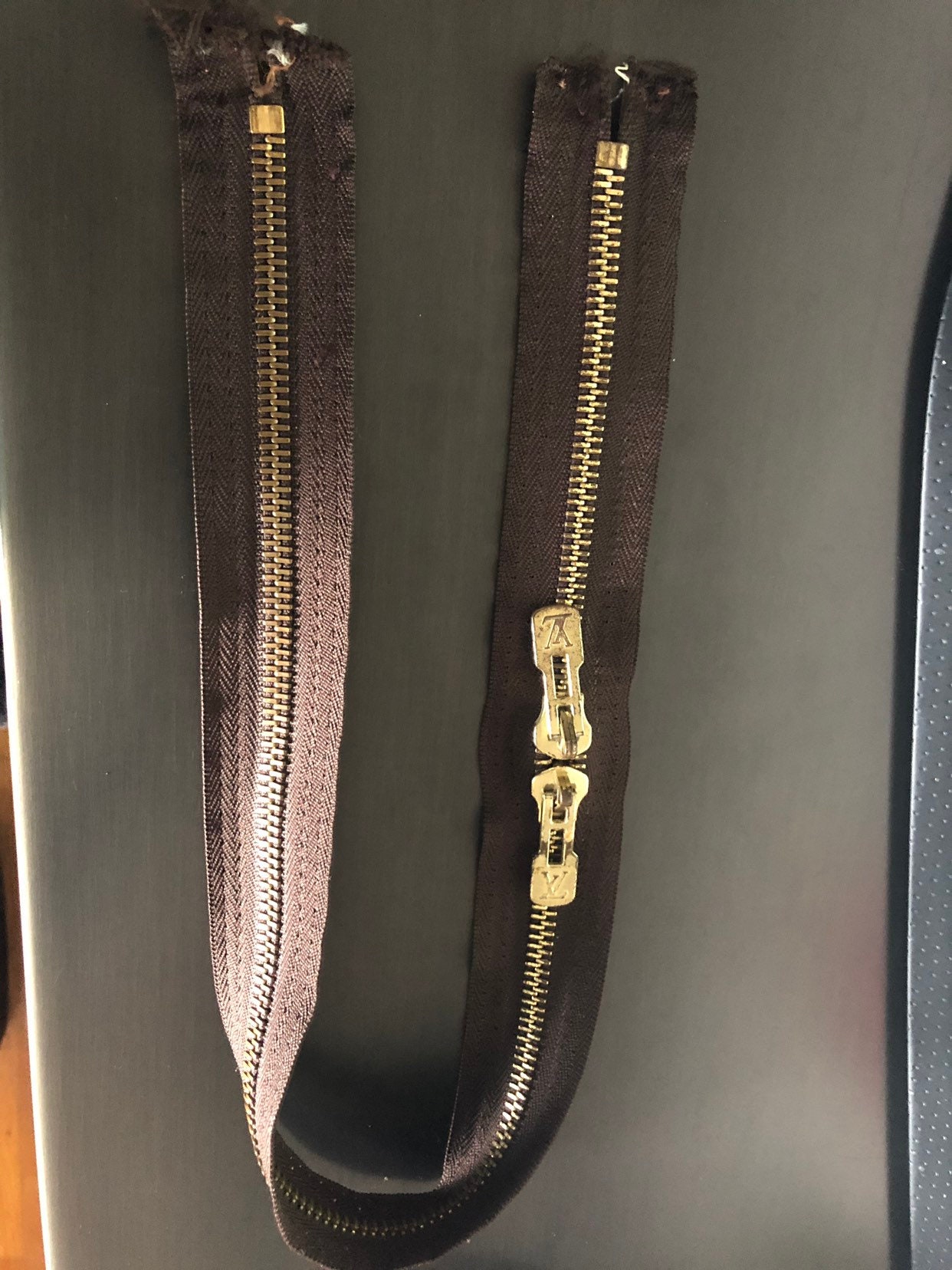 lv leather zipper pull