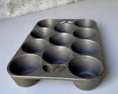 Vintage GRISWOLD cast iron muffin pan - marked Made in USA - A nice Sits dead flat - makes 11 muffins popovers - vintage kitchenware
